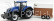 Bburago New holland T7000 Traktor s prívesom pre kone - Trasporto Cavalli 1:32 Modrá hnedá biela